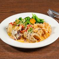 Burrito Sabanero · Large flour tortilla filled with fajita, chicken, cheese, beans, rice, and topped with our c...