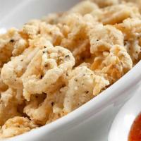Salt and Pepper Calamari · Large, Sharable portion of Crispy, fried Baby Calamari Rings & Tentacles tossed in our Speci...