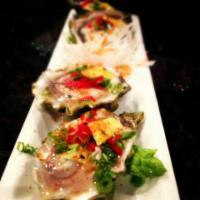 Goose Point Oysters -  2 pcs · Raw Willapa Bay oysters on a half shell - jalapeno, lime, masago, mango.  2 pcs