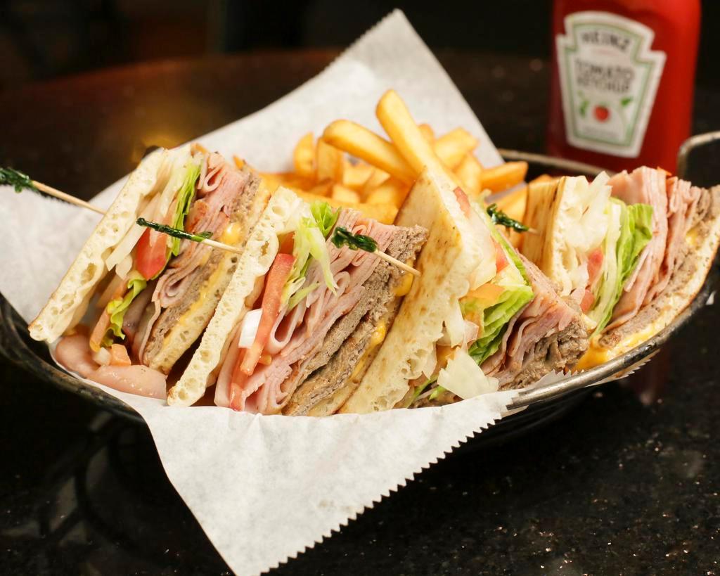 Club Charlies Wacky Club Sandwich · Roast beef, ham, American cheese, lettuce, tomato, onion and pickles snuggled between 2 pitas.