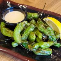 Shishito Peppers · Japanese snacking peppers - mostly mild but some are spicy! Served with our House White Sauc...