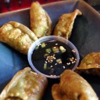 6 Pieces Pork Gyoza · Japanese dumplings with pork & chicken filling, fried and served with soy vinaigrette.