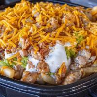 Pollo Asado Fries · topped with guacamole, cheese and sour cream