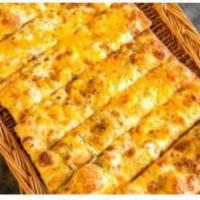 Breadsticks · 8 fresh bread-sticks made from our own delicious pizza dough coated with garlic butter and I...