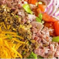 Chef Salad · Fresh cut iceberg lettuce with chopped ham, salami, chicken, tomatoes, red onions, cheddar c...