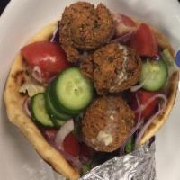 Vegan Falafel Wrap Combo · Hummus, lettuce, tomatoes, cucumbers, onions, red turnip pickles, and tahini on the side. Co...