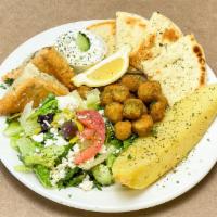 Vegetarian Plate · A Greek salad with baked oven potatoes, spanakopita, fried okra, pita bread & tzatziki sauce.