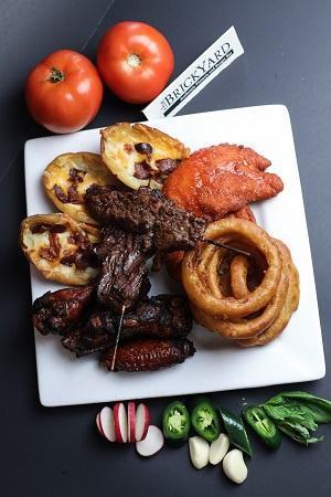 App Sampler Platter · Beef teriyaki, buffalo tender cutlets, onion rings, BRICKYARD wings & potato skins
