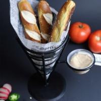 Pretzels · Bavarian style salted pretzel sticks, served with cinnamon butter.