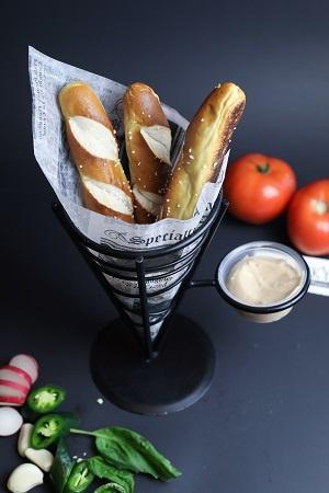 Pretzels · Bavarian style salted pretzel sticks, served with cinnamon butter.