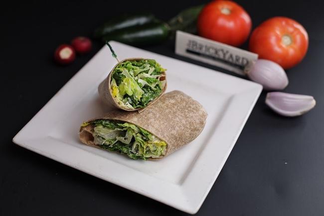 Caesar Wrap · Flour tortilla wrapped romaine, croutons & Romano cheese in a classic Caesar dressing.