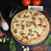 Chicken Alfredo Pizza · White pizza with sautéed chicken, a light garlic alfredo sauce & mozzarella cheese