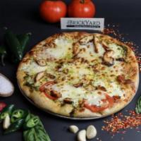 Pesto Chicken Pizza · White pizza topped with pesto sauce, grilled chicken, sliced tomato, fresh & dry mozzarella