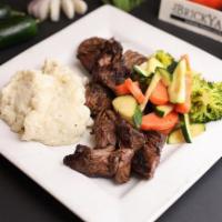 Steak Tips · 1 lb. hand cut grilled steak tips marinated in house sauce. Served w two sides.
