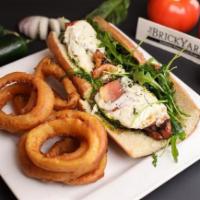 Grilled Chicken Pesto · Chargrilled chicken topped with sliced tomato, arugula, fresh mozzarella & nut-free basil pe...