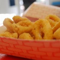 Calamari & Chips · Hand cut calamari (tubes only) soaked in buttermilk and breaded in Cajun breading. Served wi...