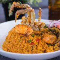 Arroz con Mariscos · Seafood rice cooked in beer, 
