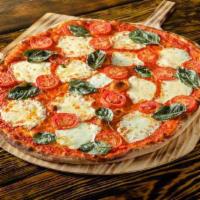 Pizza Margherita · Fresh sliced Roma tomatoes, fresh basil, chopped garlic with fresh mozzarella rounds and oli...