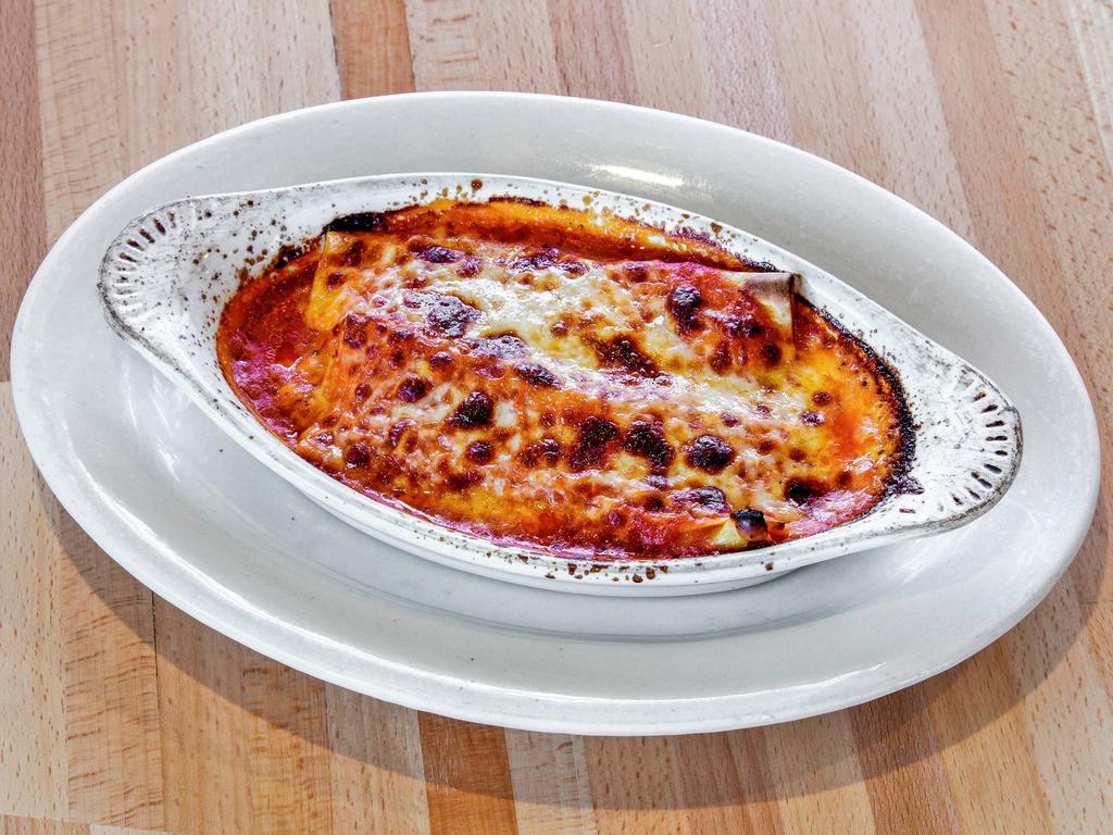 Manicotti · Pasta shells filled with ricotta, mozzarella and Parmesan cheese.