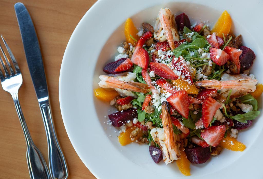 Arugula Salad* · Fresh strawberries, roasted beets, oranges, goat cheese, candied walnuts all tossed with our delicious citrus vinaigrette.
