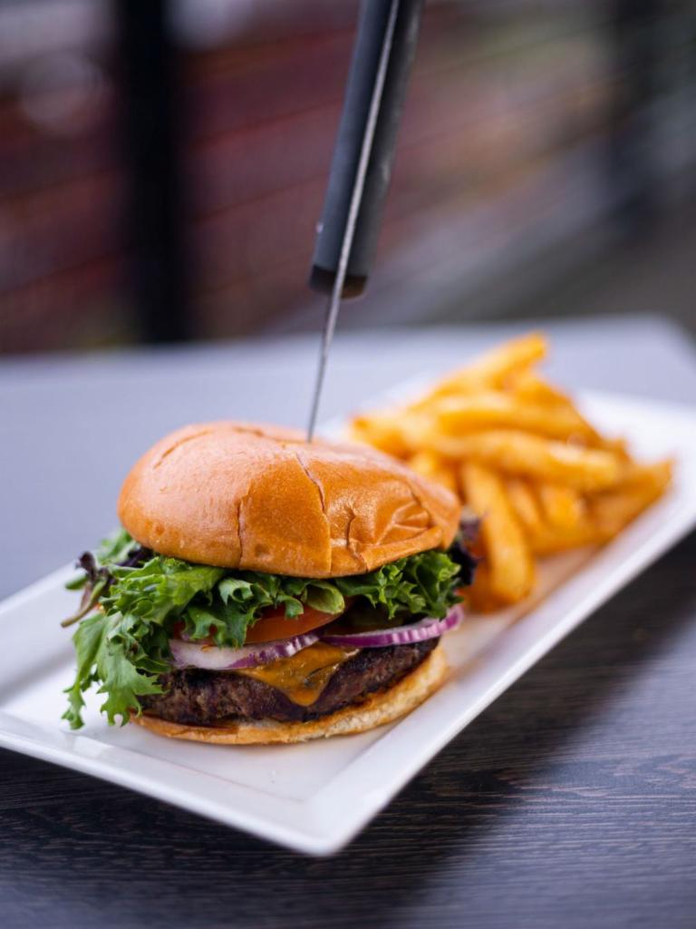 Murrayhill Burger · Burger? Can't go wrong with this one! It is a half pound Angus beef with cheddar cheese, tomatoes, onions and Arcadian mixed greens with 1000 Island dressing on a brioche bun. Served with French fries and pickles.