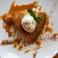 Upside Down Apple Pie · Our traditional Apple pie, served warm with caramel sauce and a scoop of a delicious Tillamo...