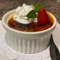 Vanilla Creme Brulee · Our vanilla custard topped with sugar and caramelized to a crisp layer, topped with whip cre...