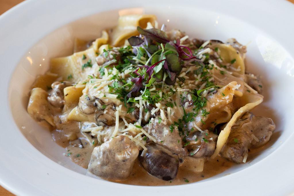 Beef Stroganoff · Beef tenderloin steak tips with gourmet mushrooms, cippolini onions, fettuccini pasta with parmesan cheese tossed with sherry wine cream sauce.