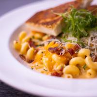 Mac & Cheese · The Mac & cheese is one of our most popular dishes, in which has Cavatappi pasta cooked with...