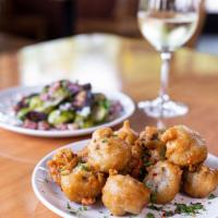 Fried Mushrooms · Our fried mushrooms are coated in a light and crispy seasoned beer batter, then deep fried t...