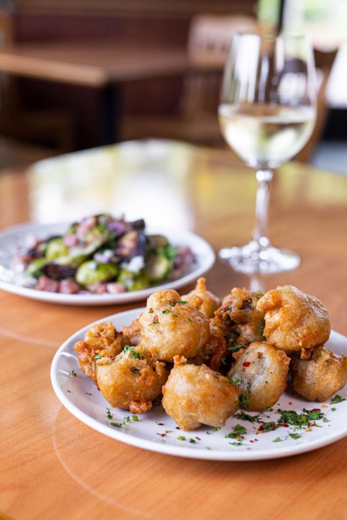 Fried Mushrooms · Our fried mushrooms are coated in a light and crispy seasoned beer batter, then deep fried to golden brown perfection, topped with a touch of Parmesan cheese, parsley and red pepper flakes.