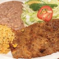 22. Milanesa de Res · Breaded beef steak served with beans, rice, and tortillas.