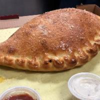 Calzone · Pizza dough folded, filled with Parmesan, ricotta, mozzarella cheese and Italian herbs.