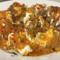 Mantoo veggie · Steamed dumpling with m inushrooms, cabbage, onion, spices, topped with garlic yogurt, split...