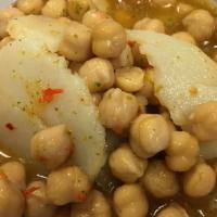 Shornakhood · Chickpeas mixed with chutney and shredded boiled potato.