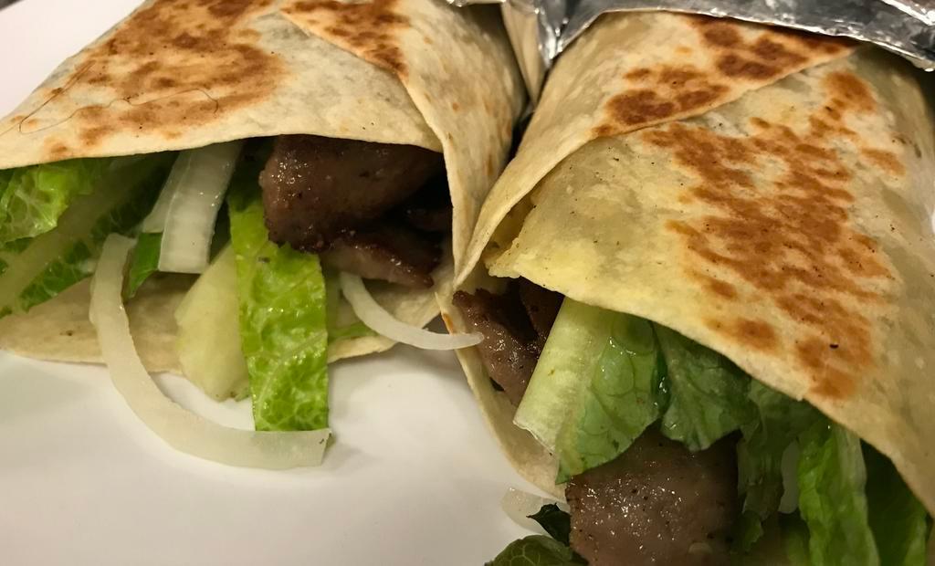 Beef Gyro · Thin slices of seasoned beef, cooked on flat grill and served on warm pita bread filled with tomatoes, onions, lettuce, cucumber and special sauce