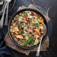 Samosa Chaat · 2 pieces. Crushed samosa, spruced with chickpeas, and tamarind and dates chutney sprinkled o...