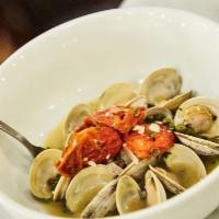 Steamed Littlenecks · Served in a limoncello-caper broth, with heirloom tomatoes, fresh basil and grilled focaccia.