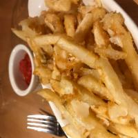 Parmigiano Truffle Fries · With roasted red pepper ketchup.