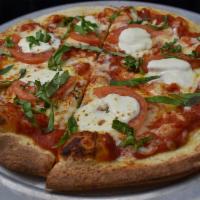 Margherita Pizza · Heirloom tomato, fresh mozzarella, basil.