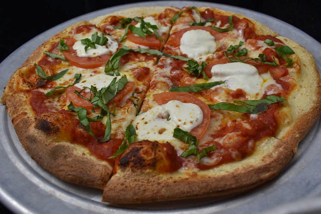 Margherita Pizza · Heirloom tomato, fresh mozzarella, basil.