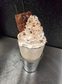Sweet and Salty Milkshake · Twix pieces, caramel and chocolate cookie, chocolate dipped pretzel, whipped cream and more ...