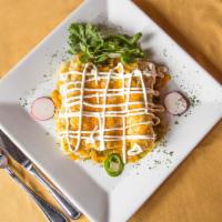Suizas Enchilada · Green sauce enchiladas w/ chicken topped with melted cheese and sour cream. Served with rice...