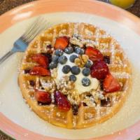 Multigrain Waffle · Topped with Greek yogurt and assorted berries.