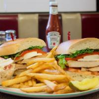 Grilled Chicken Club Sandwich · Chicken breast, bacon, lettuce, tomato, American cheese. Served with french fries.