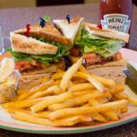 Tuna Melt Sandwich · Tuna salad on an English muffin topped with melted American cheese and tomato. Served with f...