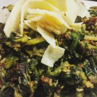 Brasserie Greens · Fresh escarole sauteed in butter with garlic, hot peppers, lardons, Parmesan, and white wine.