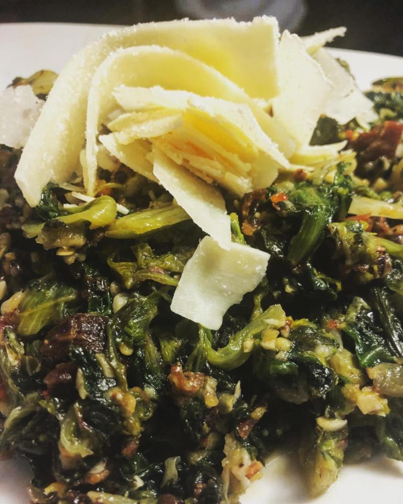 Brasserie Greens · Fresh escarole sauteed in butter with garlic, hot peppers, lardons, Parmesan, and white wine.