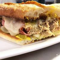 Cubano Sandwich · Shredded pork, ham, mustard, dill pickle and Swiss cheese on a toasted baguette.