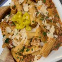 Riggies · Rigatoni pasta tossed in a vodka cream sauce, cherry pepper relish, banana peppers, and Parm...